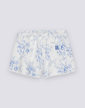 PANTALONES CORTOS DE NIÑA CON CORTES EN BRUTO EN ALGODÓN BULL CON ESTAMPADO ROSE DE JOIE
